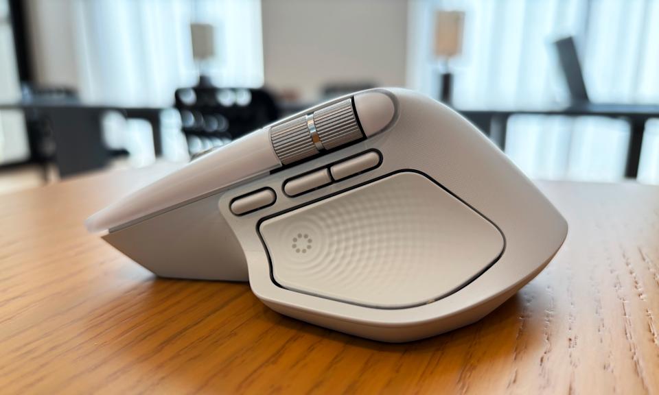The side profile of the Logitech MX Master 4, showcasing the new Actions Ring button and haptic feedback panel built into the mouse's large thumb rest.