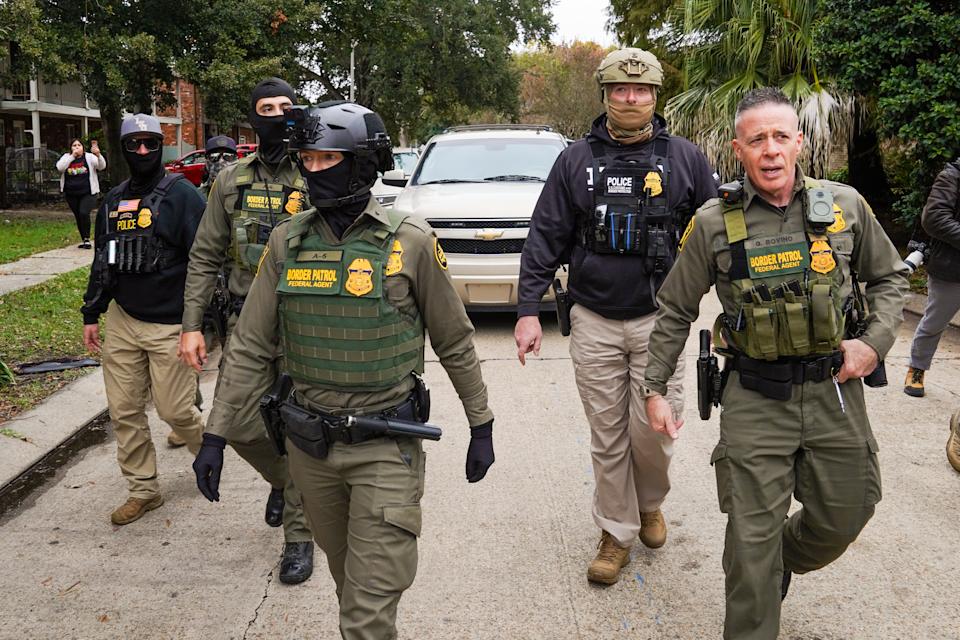 NEW ORLEANS, LOUISIANA - DECEMBER 5: U.S. Chief Border Patrol Agent, Gregory Bovino and other agents conduct an immigration enforcement operation in a neighborhood on December 5, 2025 in New Orleans, Louisiana This comes on the third day of the operation in Louisiana, 'Catahoula Crunch,' launched by the Department of Homeland Security as a part of an immigration crackdown on undocumented immigrants in the United States. (Photo by Ryan Murphy/Getty Images)