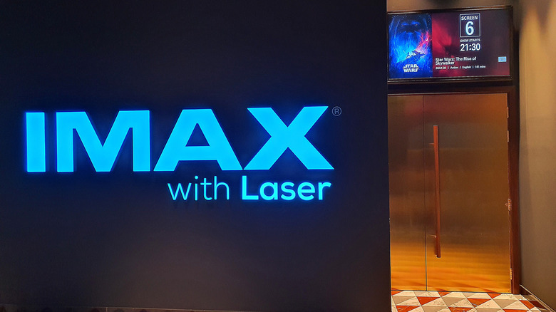 Movie theater entrance with IMAX with Laser banner.