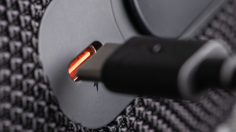 Thunderbolt cable positioned to connect with the port.