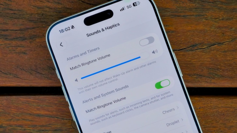 Changing ringtone and alarm volume settings on iPhone.