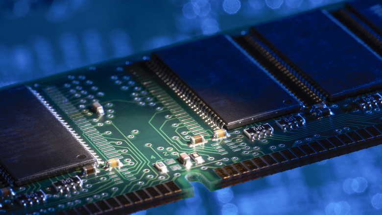Close-up of memory chips mounted on a RAM module.