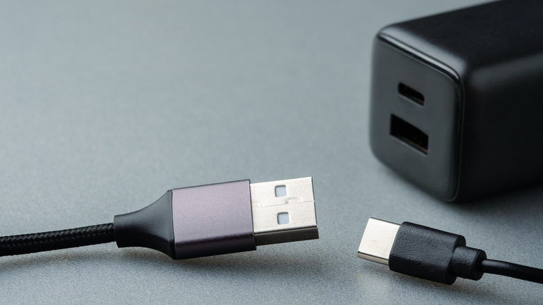 A charger with USB-A and USB-C ports and two cables.